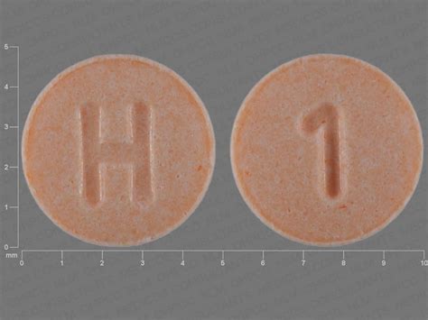 A product of Mallinckrodt Pharmaceuticals, the M 05 52 is a <b>round</b>, white <b>pill</b> that has the company's M logo <b>on one</b> <b>side</b> and 05 and 52 split by a vertical line on the other. . Round peach pill with 5 on one side